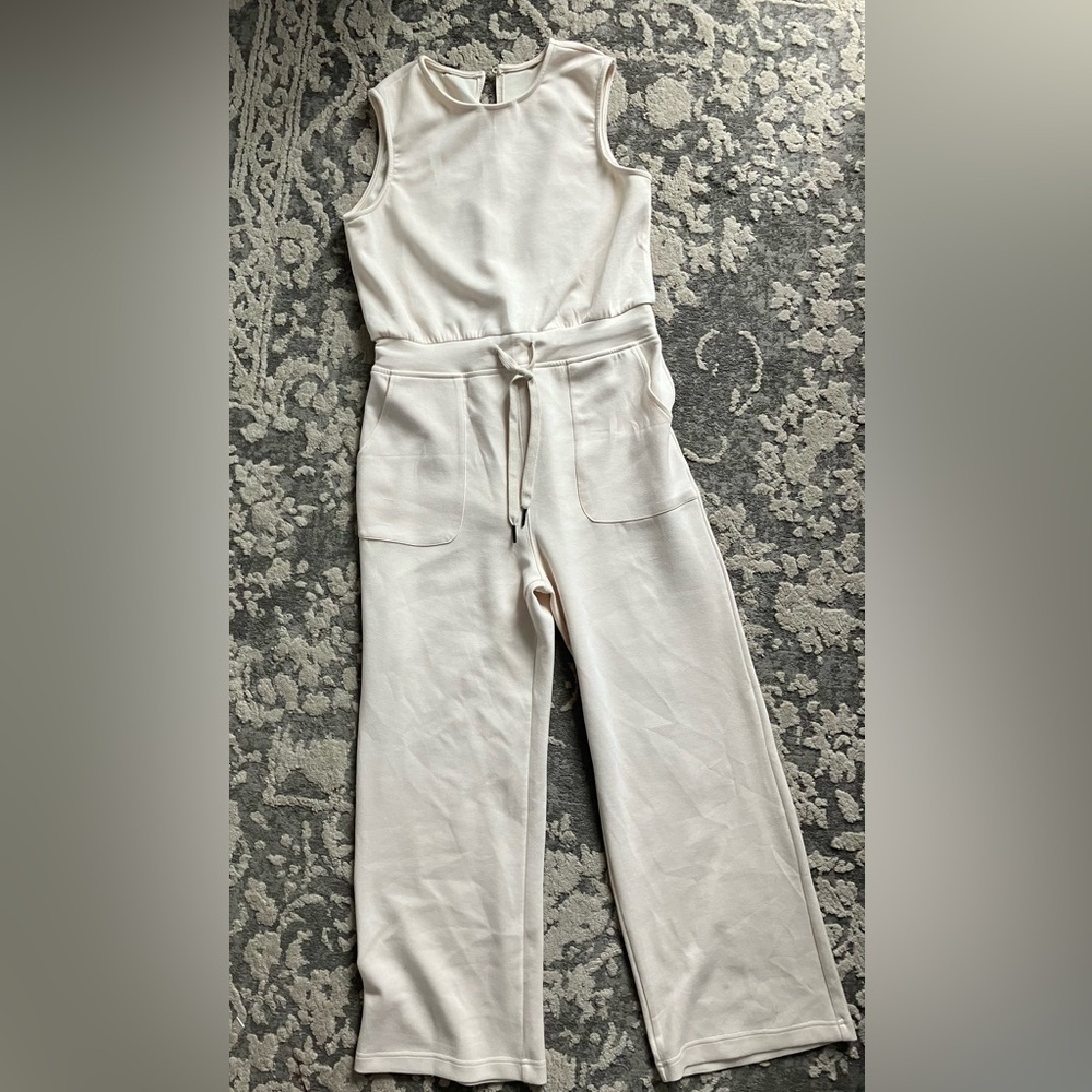 Girls size 12 cream color jumpsuit.